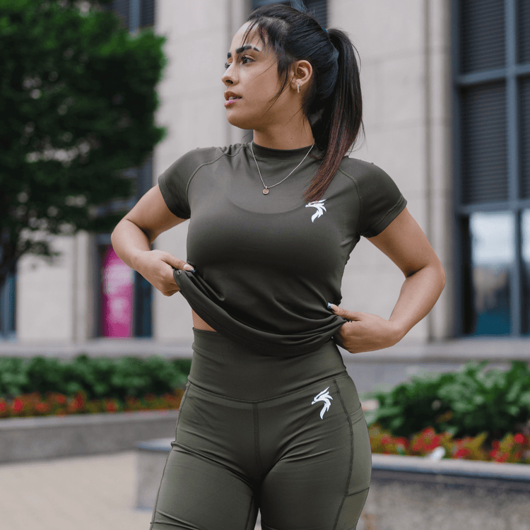 Women’s athletic shirts, including performance tops, breathable workout tees, and moisture-wicking sports shirts designed for strength, movement, and comfort.