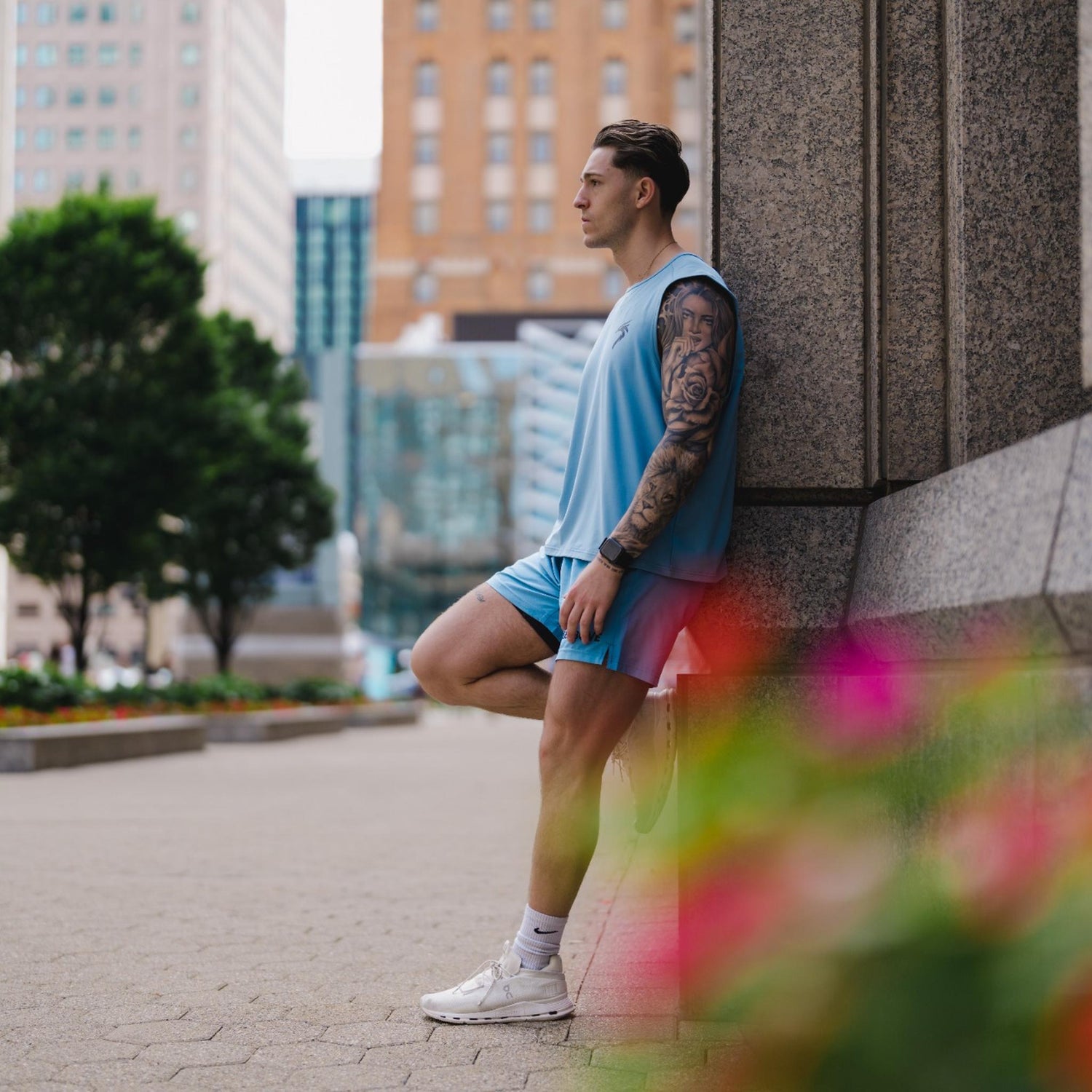 A collection of recovery tank tops and activewear designed for men and women, including symbolic shirts and sports bras that promote healing, resilience, and sobriety—crafted for comfort, performance, and recovery.